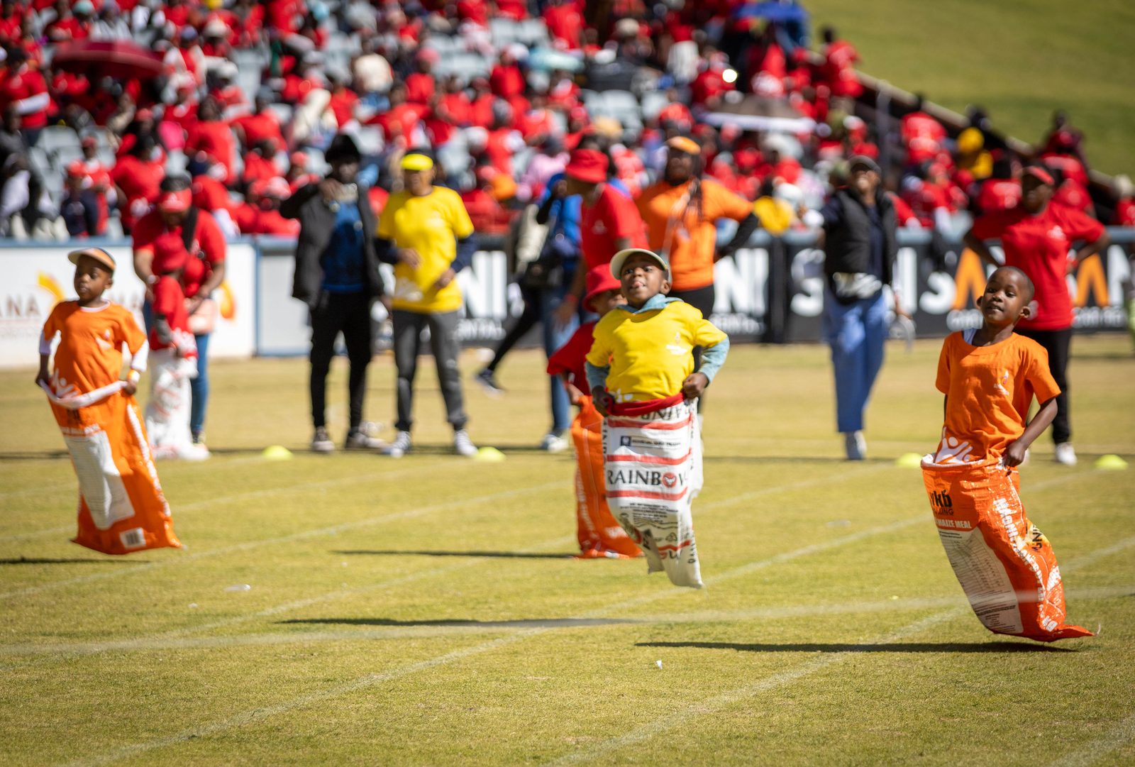 Children competing in a sack race at an Afrika Tikkun sports day